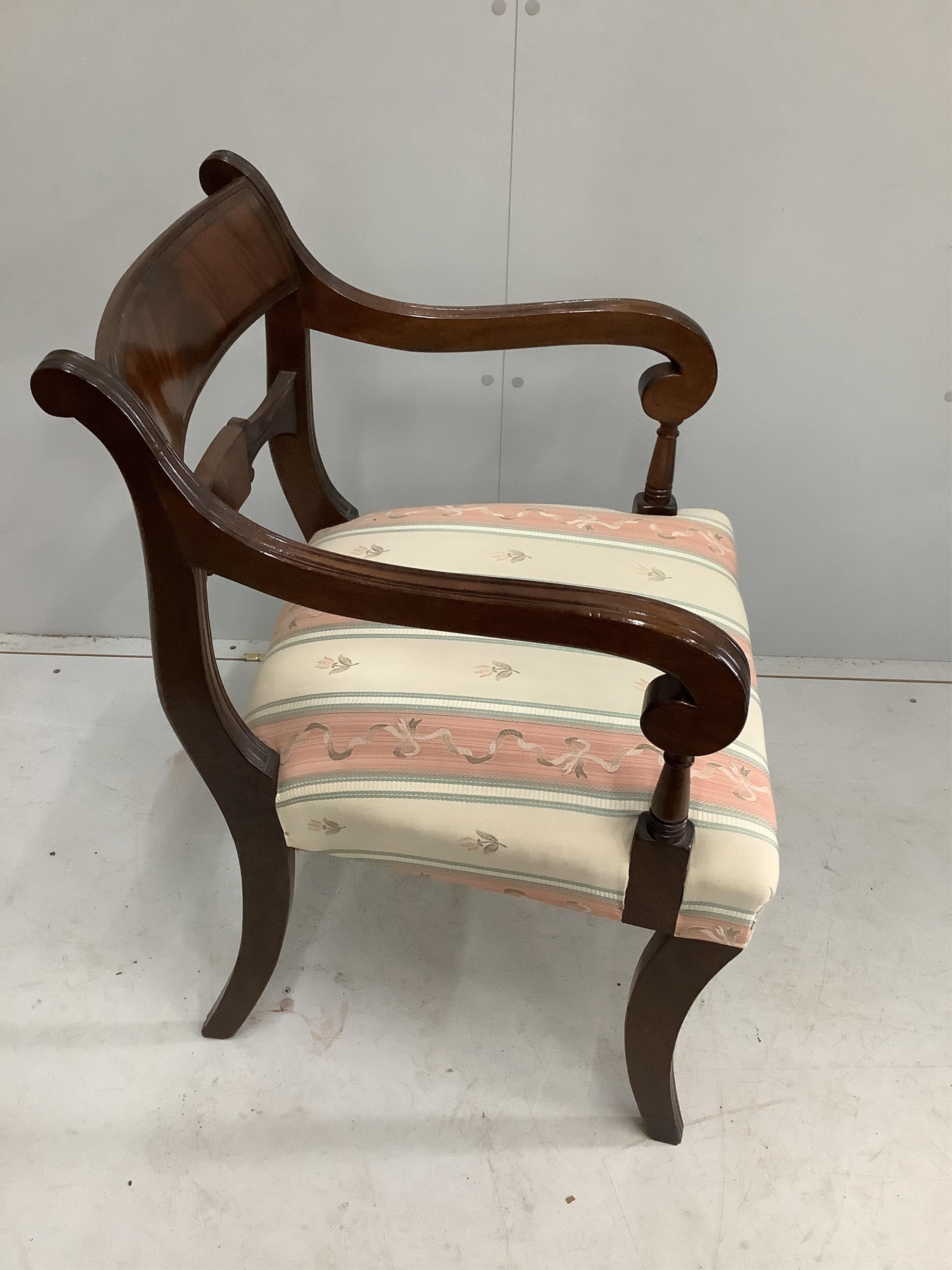 A set of eight reproduction Regency style mahogany sabre leg dining chairs, two with arms